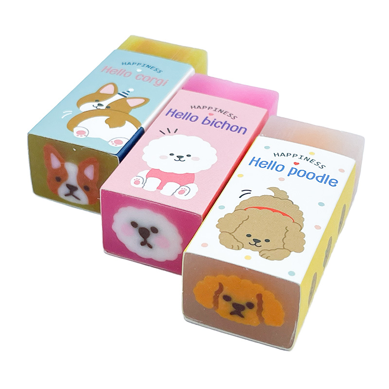 SZ-22-001_Radierer_hunde 3 rechteckige Radierer in verschiedenen Farben und unterschiedlichen Hundegesichtern in Papierhüllen.