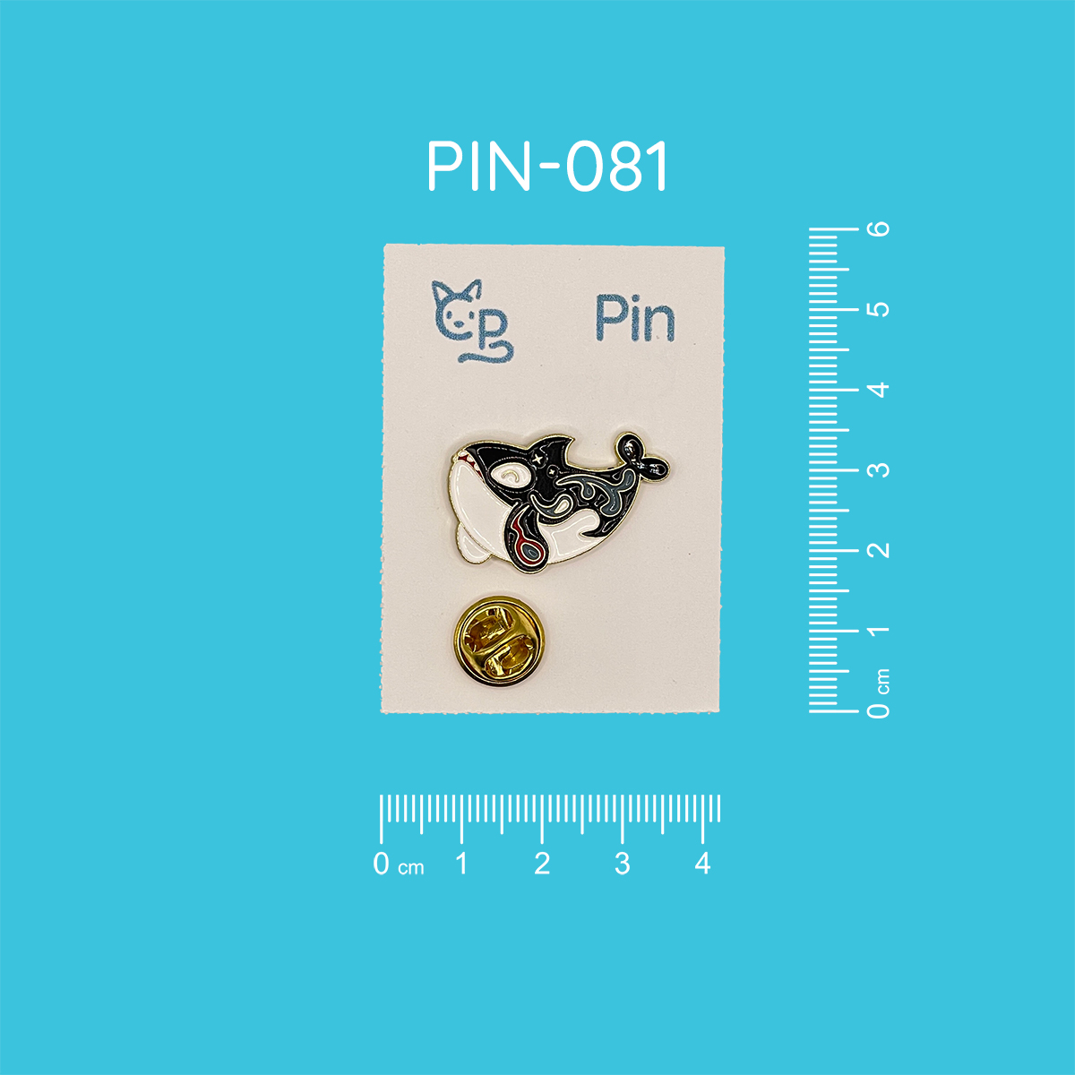 Pin mit dem Motiv eines grinsenden Orcas.